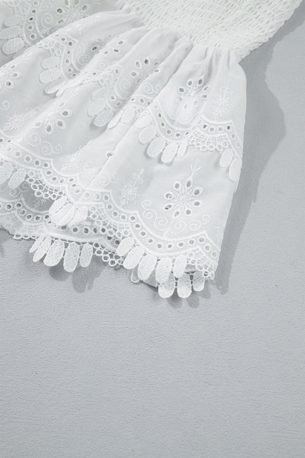 White Sleeveless Smocked Lace Peplum Top