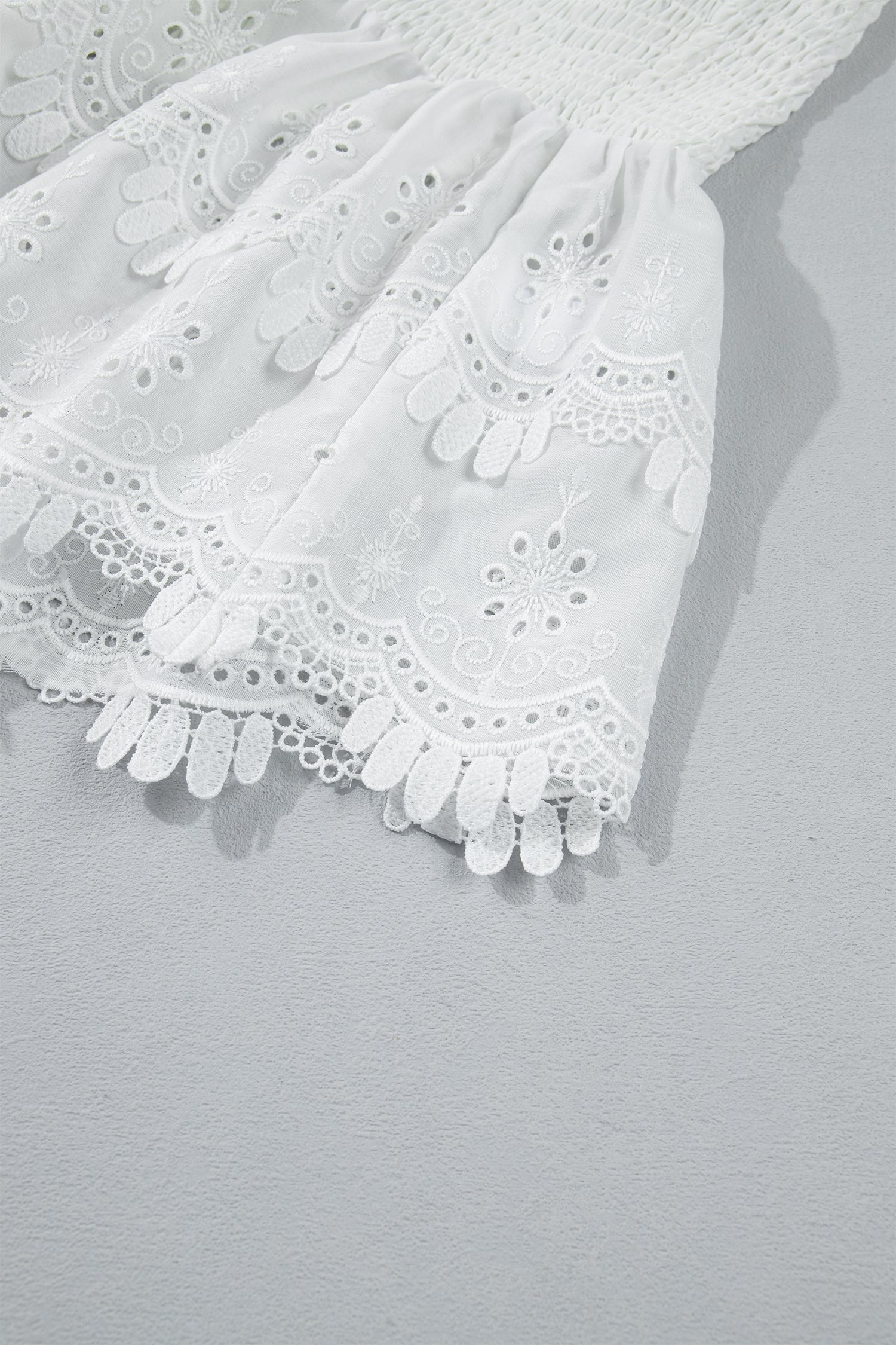 White Sleeveless Smocked Lace Peplum Top
